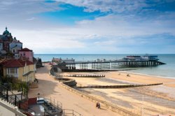 Unspoilt UK seaside town with traditional Victorian pier that was once split in two