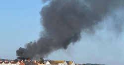 Huge fire erupts in Rhyl with thick black smoke seen for miles - 'Close windows'